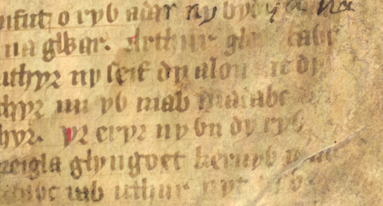 Jesus College MS 20, folio 1r, que mostra Eliwlod a chamar-se filho de ‘Madawc’ (fim da linha central)